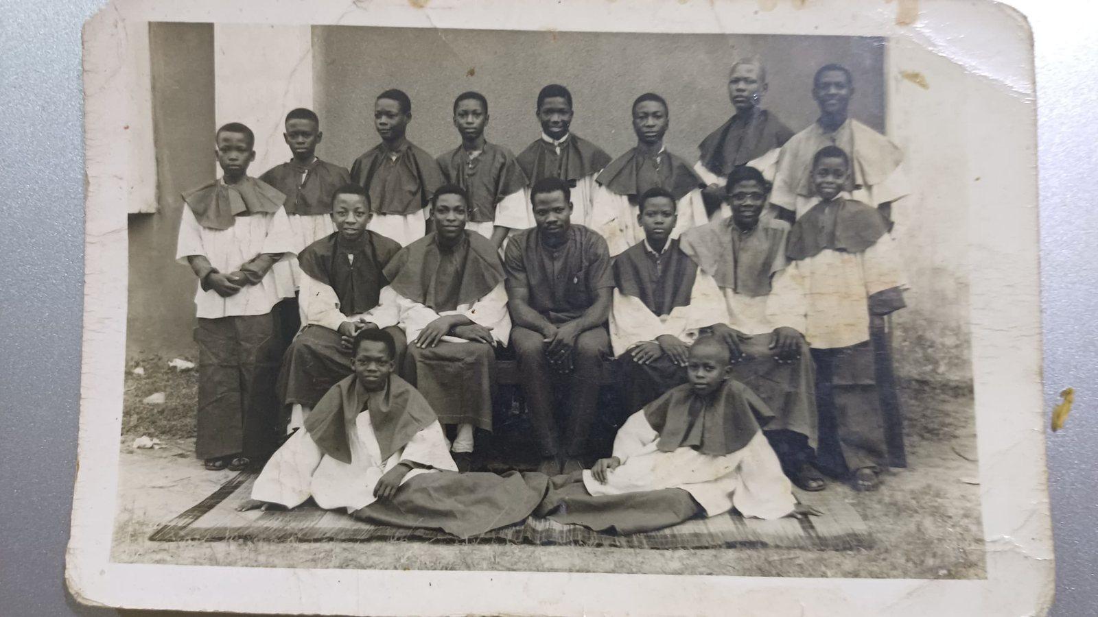 An old group photograph of young altar servers in cassocks and surplices, from Padre Mike’s archive
