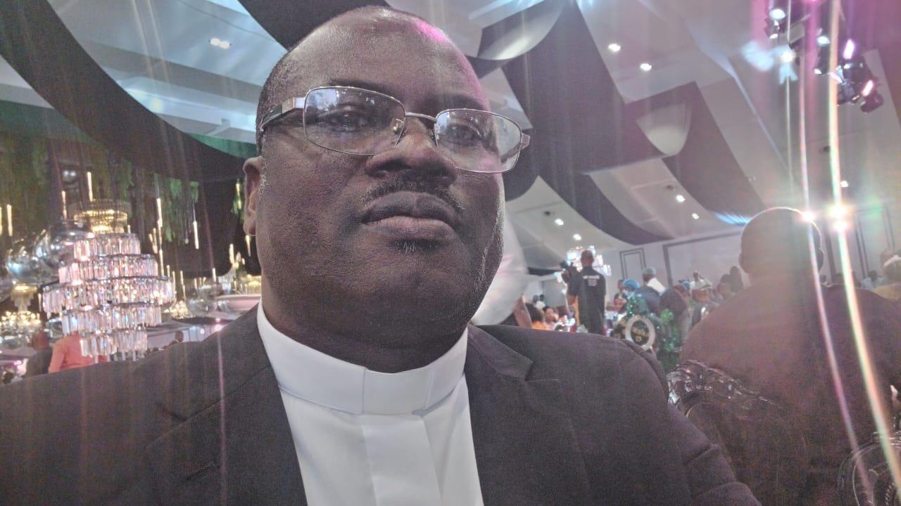 Padre Mike at an evening reception