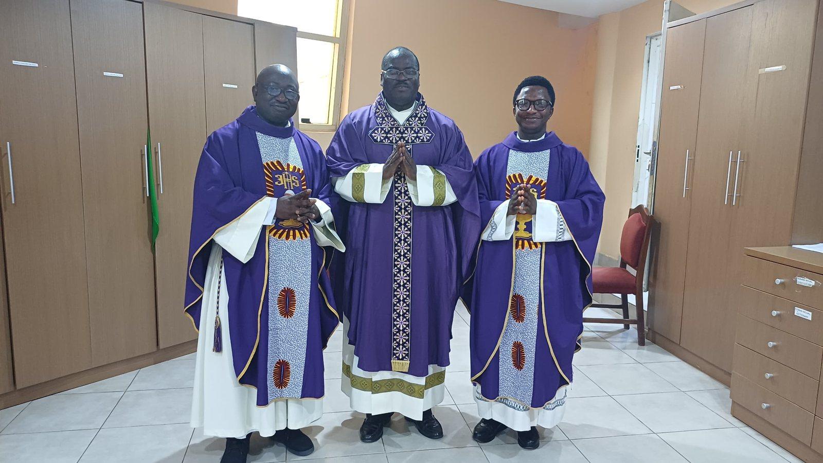 Padre Mike with two brother priests in violet vestments