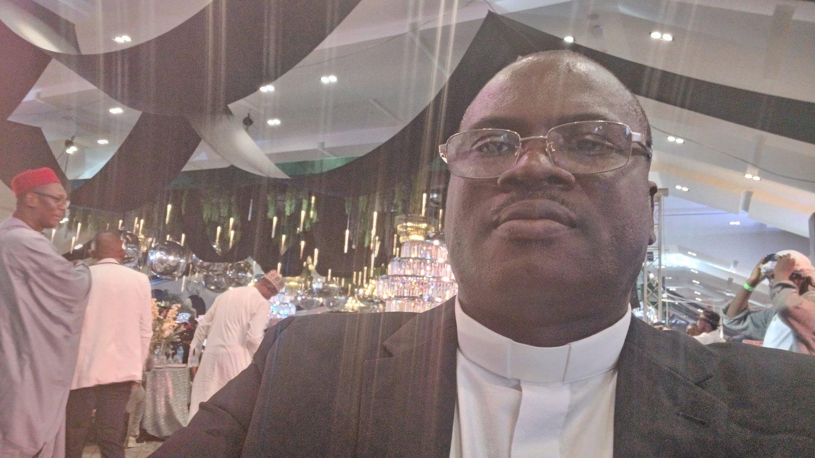 Padre Mike at an evening reception