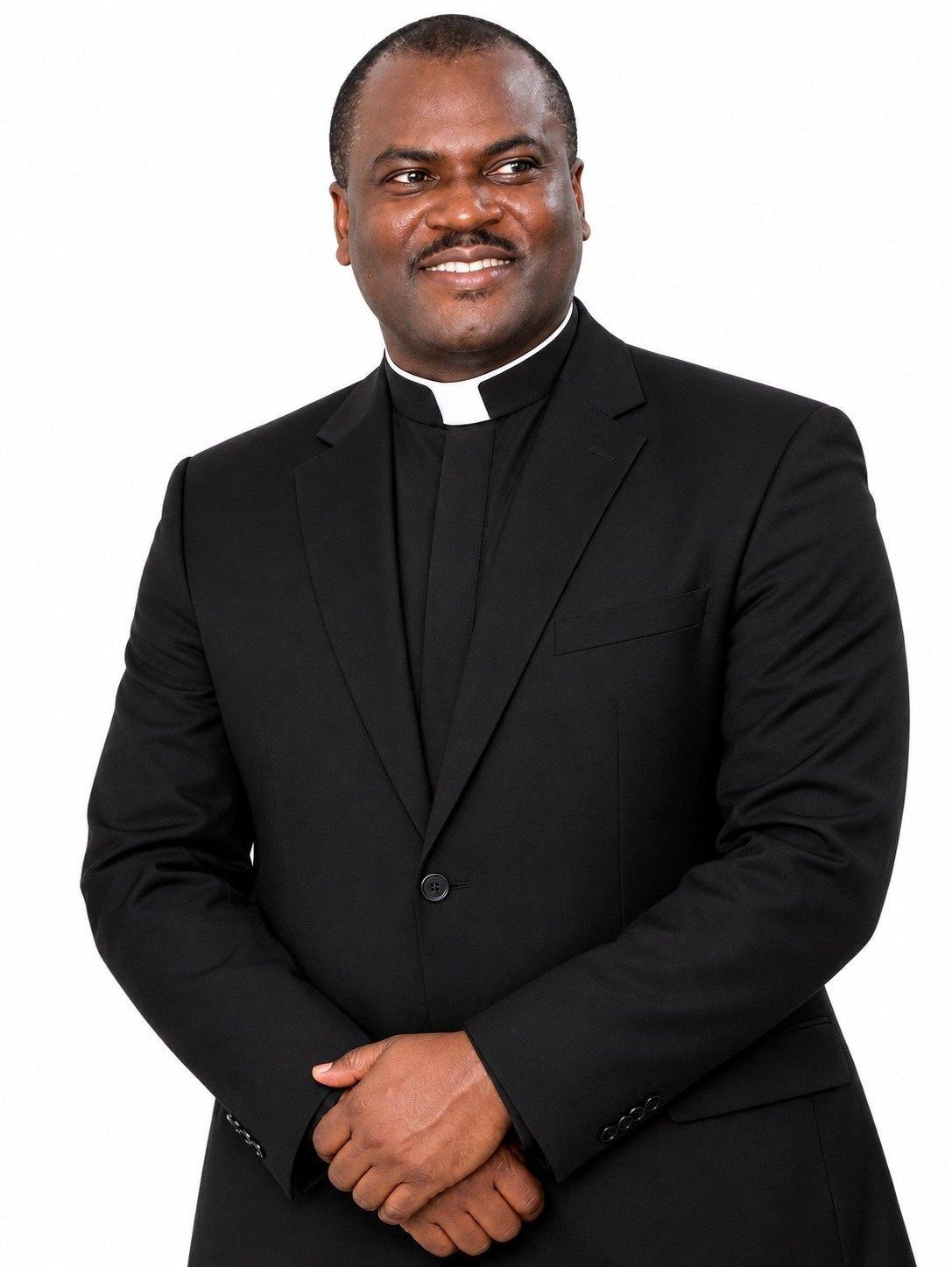 Rev. Fr. (Dr.) Michael Nsikak Umoh, Padre Mike, in clerical dress